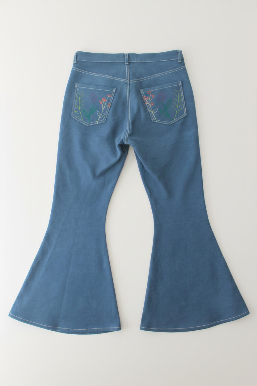 Lay flat back view of floral flared jeans