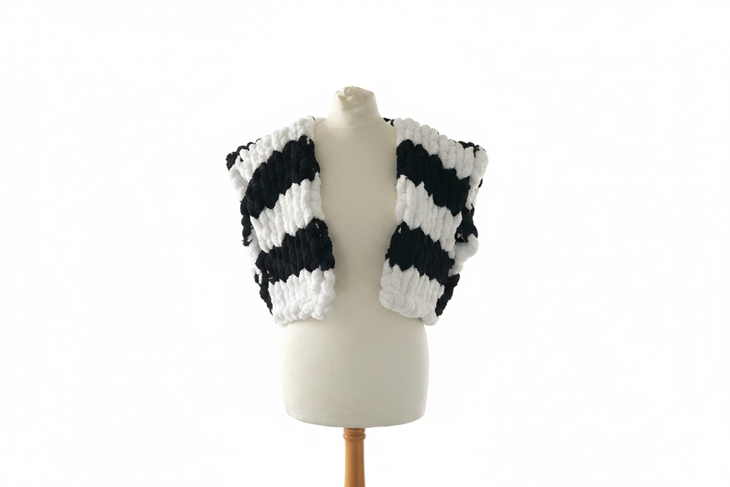 Black and white striped chunky knit open cardigan vest on mannequin with white background