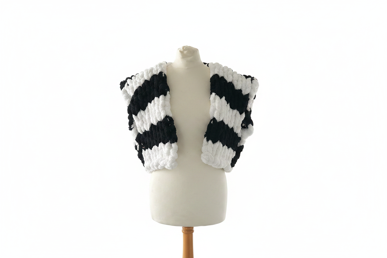 Black and white striped chunky knit open cardigan vest on mannequin with white background