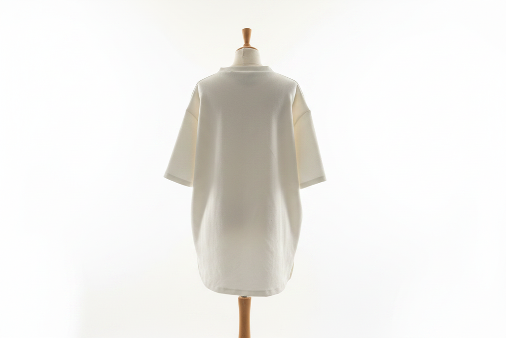 Cream oversized t-shirt back view on mannequin with white background