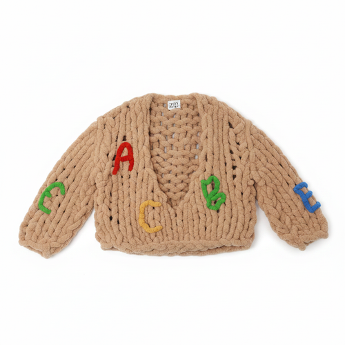 ABC Cardigan lay flat on white background