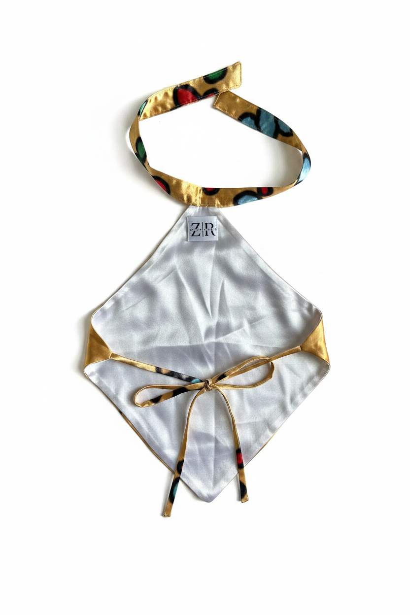 Gold satin floral halter top reverse lining side flat lay on white background