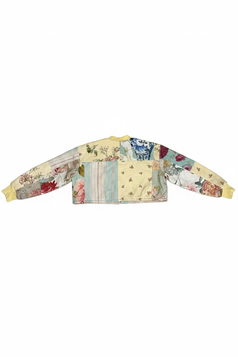 Patchwork floral cropped bomber jacket back view flat lay on white background