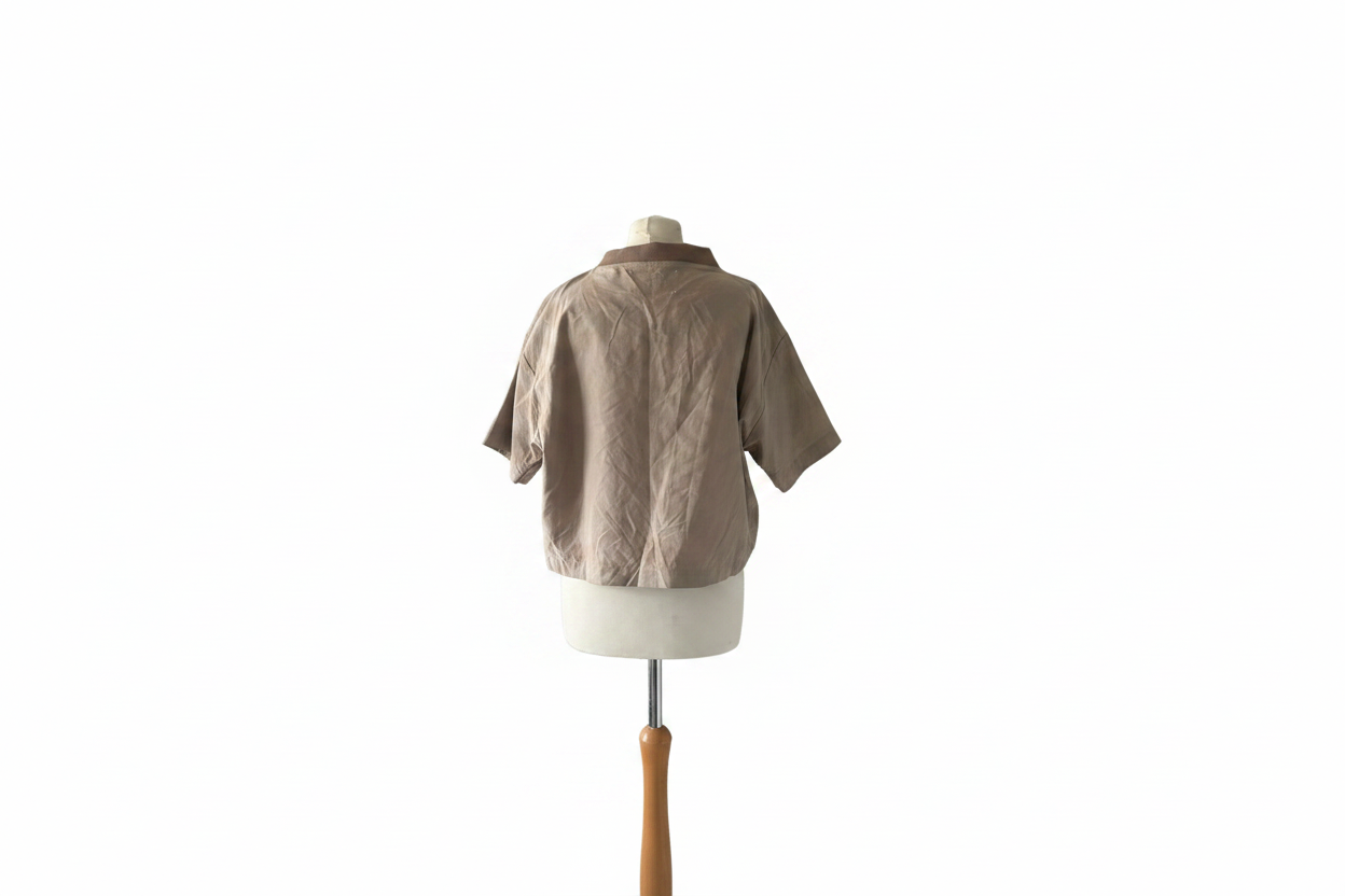 Beige cropped shirt back view on mannequin with white background