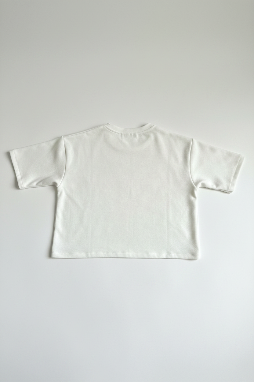 White cropped oversized tee back view flat lay on white background